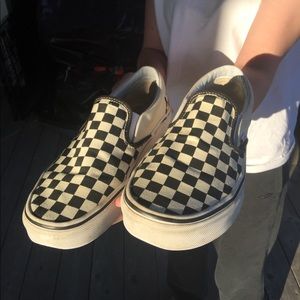 Black and white checkered slip on vans